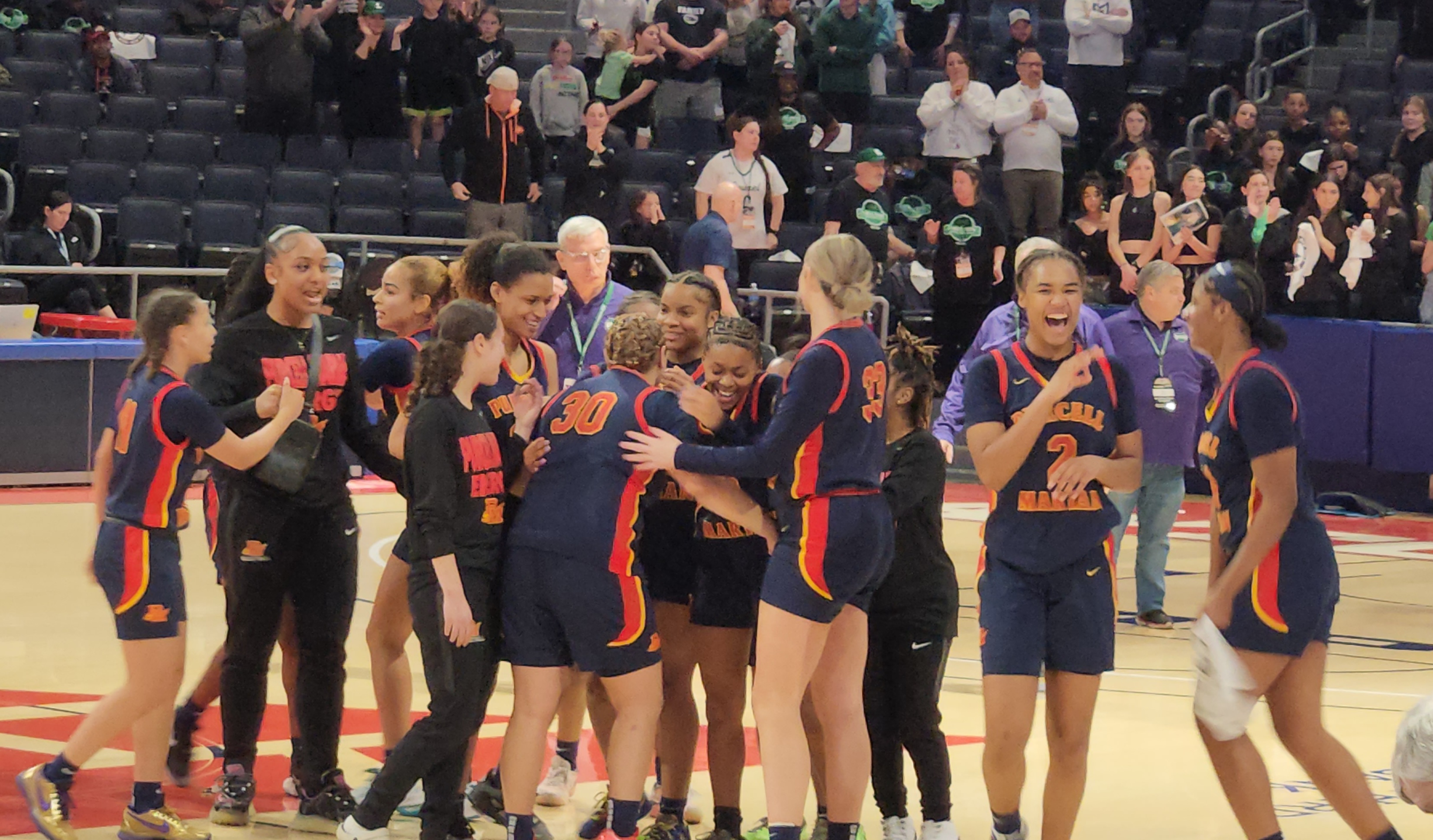 Purcell Marian players celebrate winning the 2024 Division II state championship.